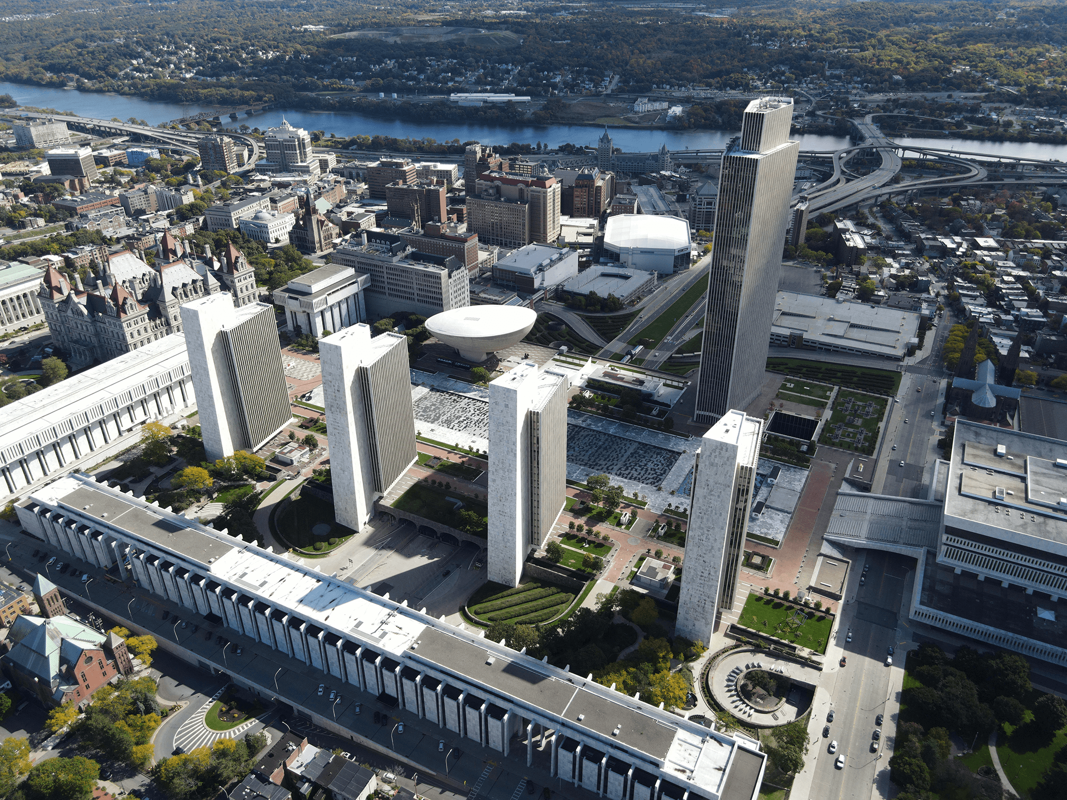 https://storage.tally.so/6fae9567-f64f-446e-87e7-9375a92182c0/Empire_State_Plaza_from_the_air.png