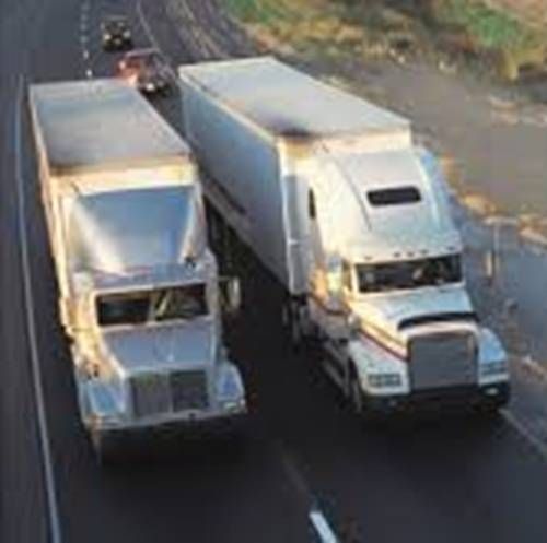 https://storage.tally.so/9635a8ec-ad8a-4822-9cad-dd6b6caeeb58/Semis-passing-another-semi-very-slowly.jpg