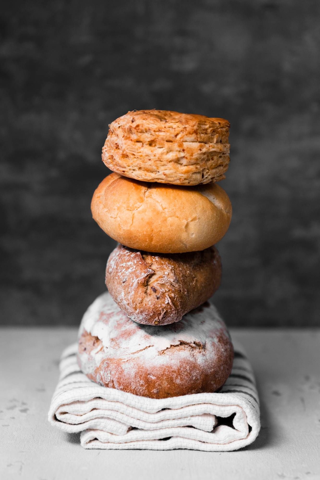 https://storage.tally.so/ca1ed7e2-b3ca-4a52-8929-ada390615fcf/close-up-tower-various-types-bread.jpg