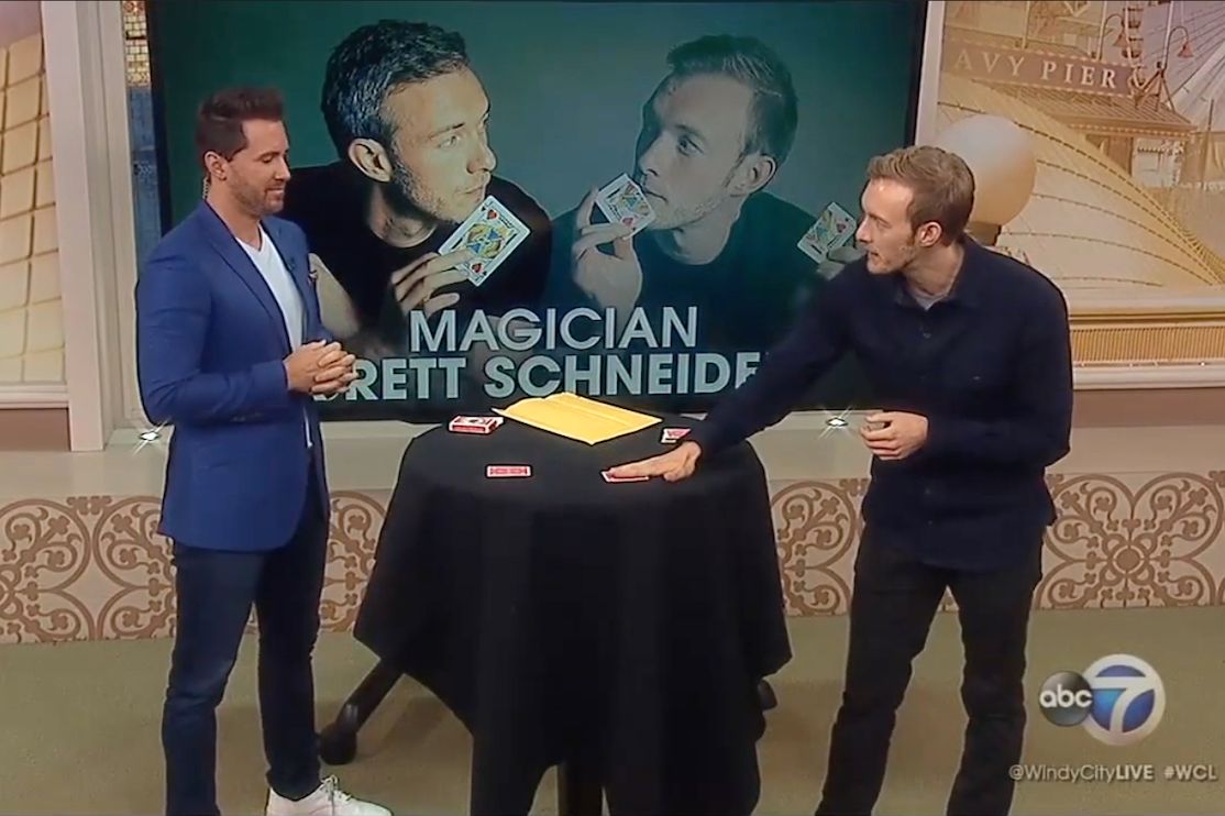 Performing photo of magician Brett Schneider