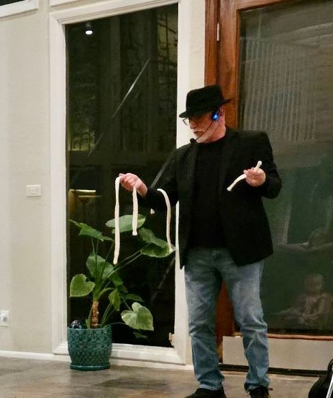 Performing photo of magician Rob Haddon